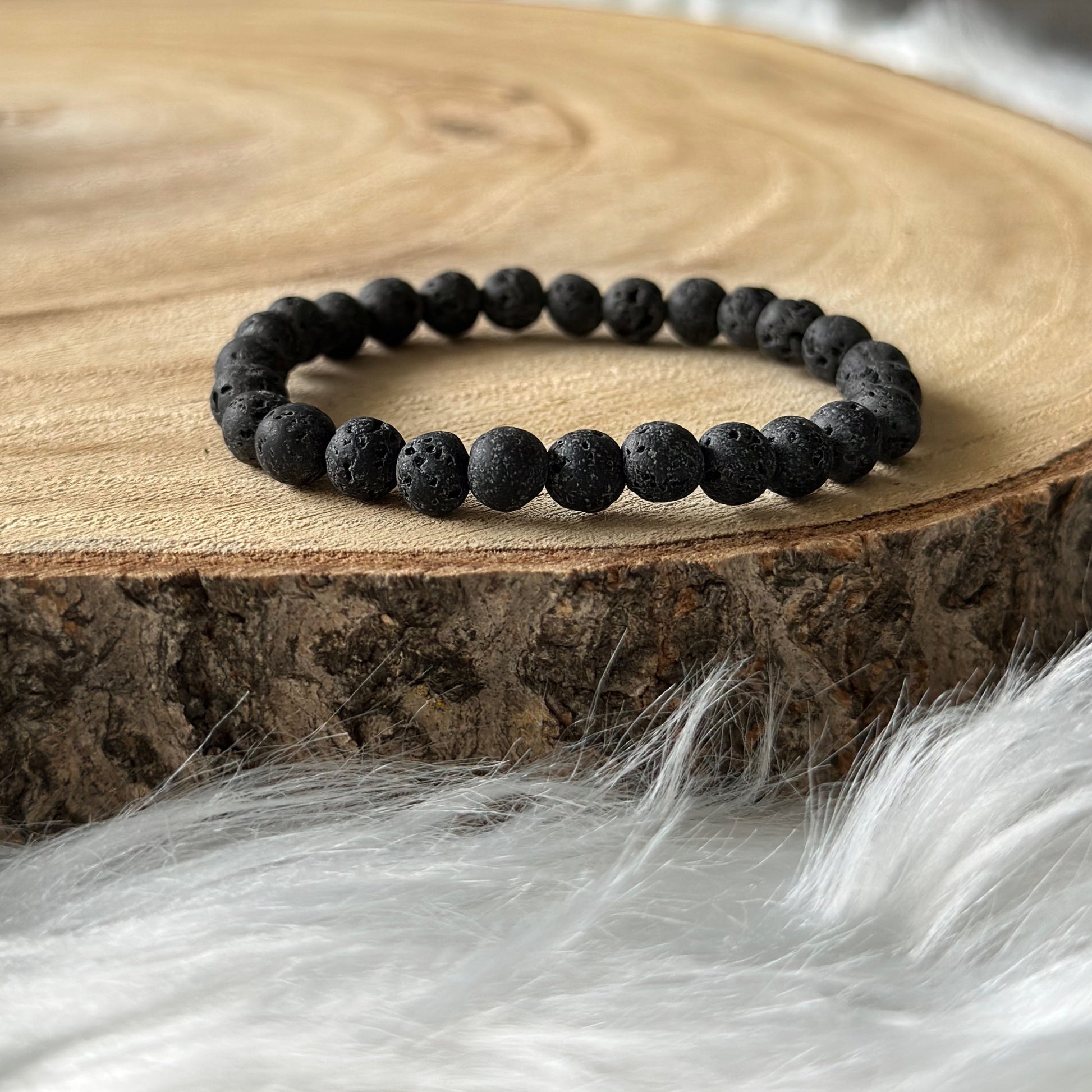 bracelet pierre de lave sur bois et tiss