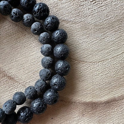 2 bracelets pierre de lave sur bois 