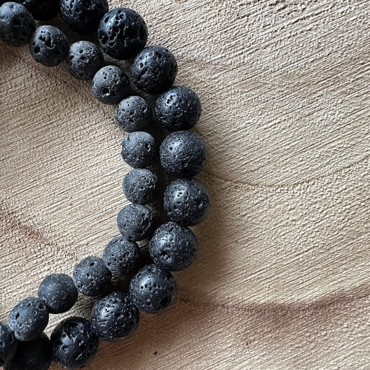 2 bracelets pierre de lave sur bois 