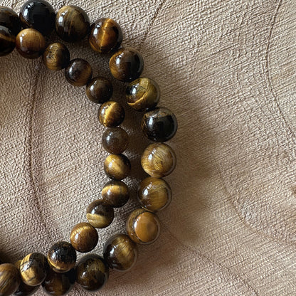 2 bracelets oeil de tigre sur bois