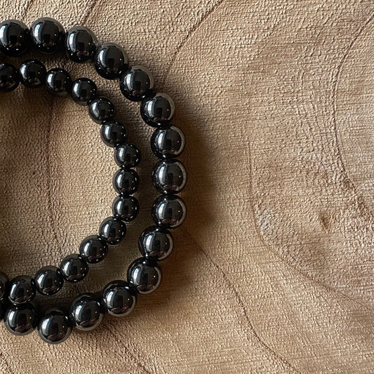 2 bracelets hématite sur bois 